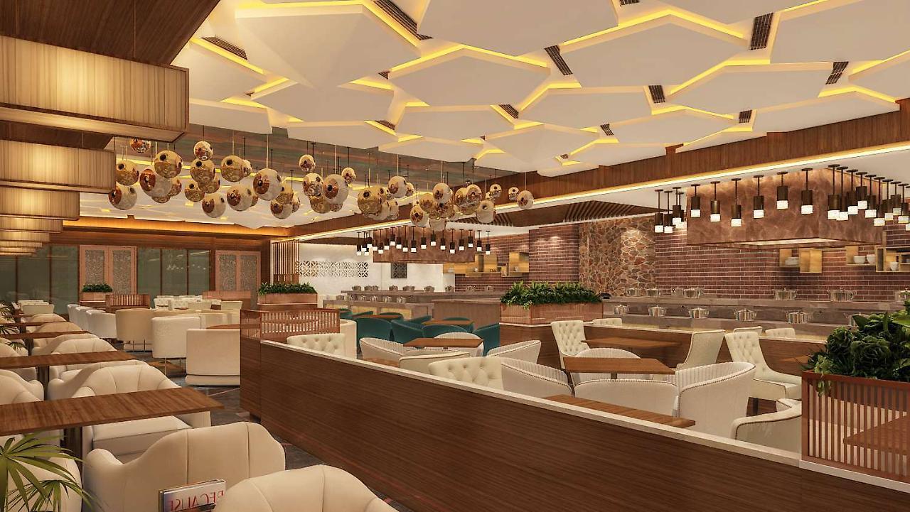 ホテル Radisson Blu Towers Kaushambi Delhi Ncr ガーズィヤーバード エクステリア 写真 Interior of a restaurant
